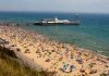 Photo of crowded Bournemouth beach by Dami Akinbode via Unsplash